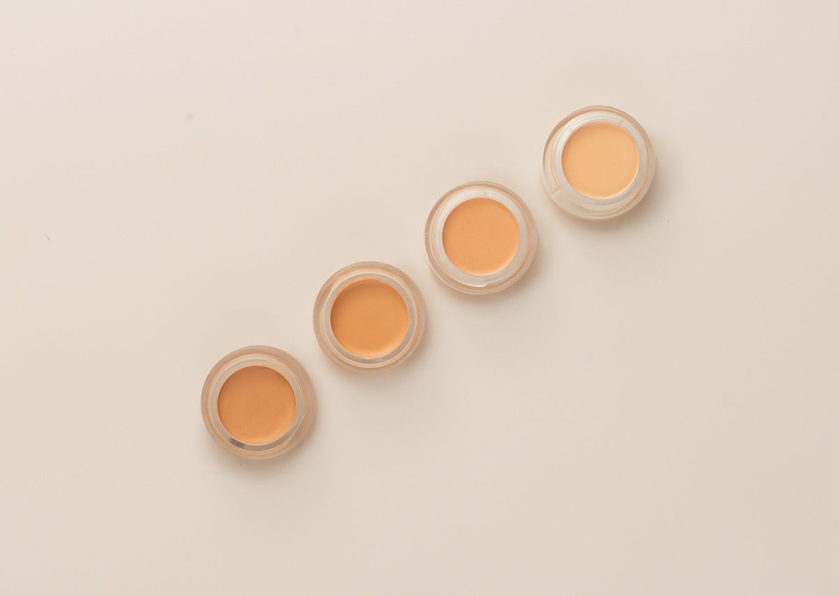 Hydrating Concealer four jars in a diagonal row