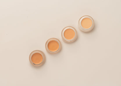 Hydrating Concealer four jars in a diagonal row